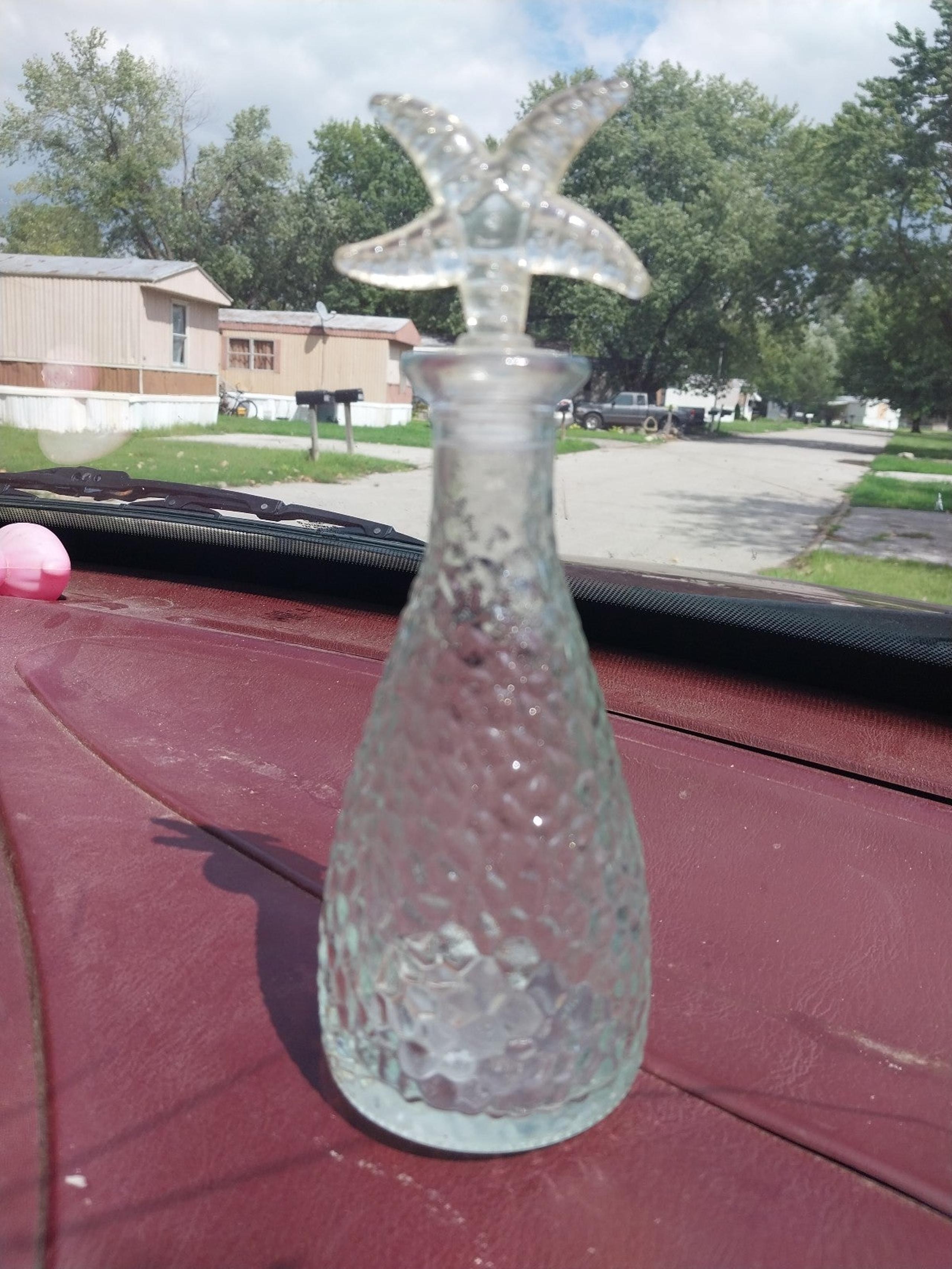 Vintage glass bottle with star top