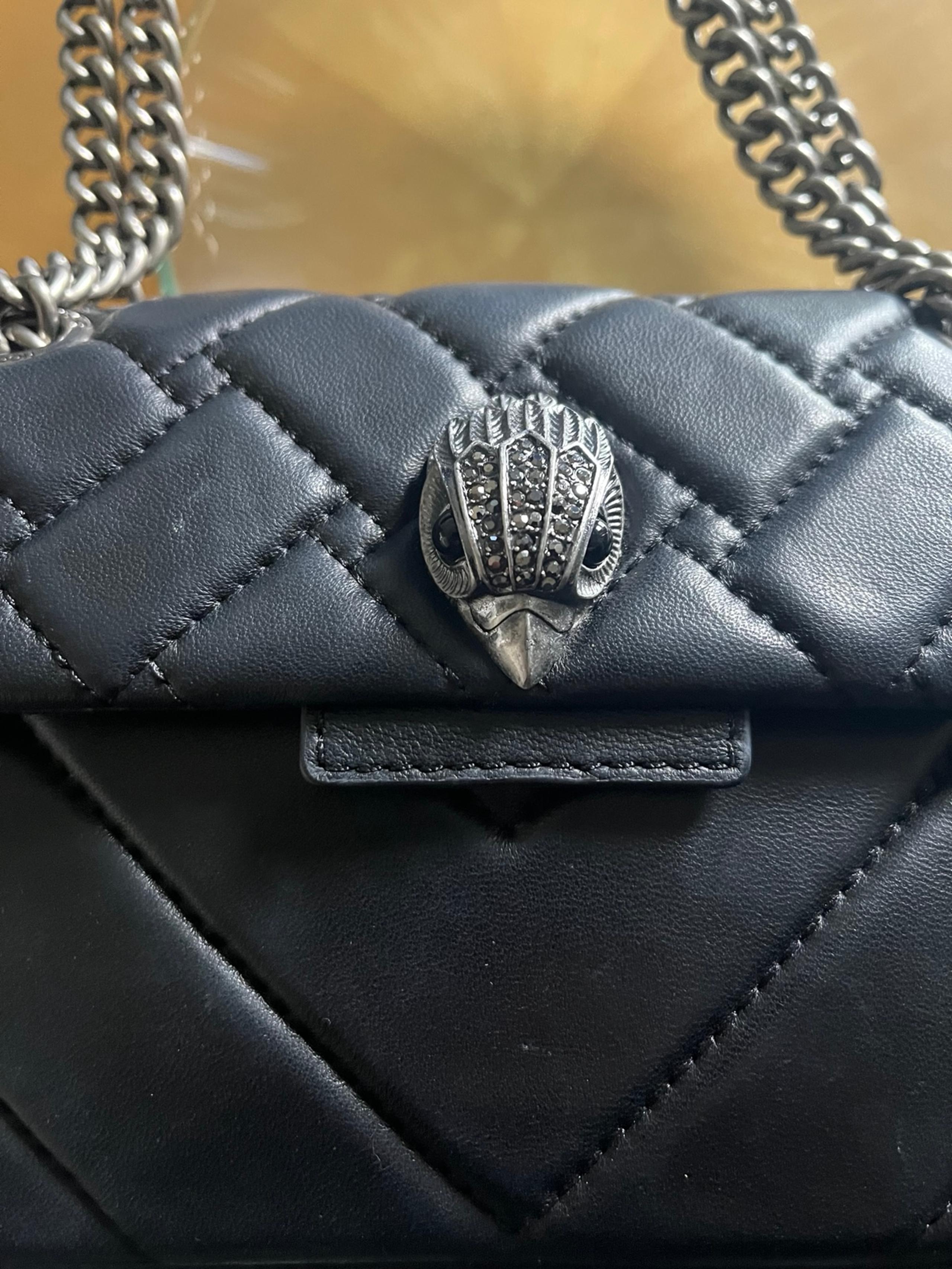 Elevate your look with this stunning Kurt Geiger convertible bag! This 2-in-1 de