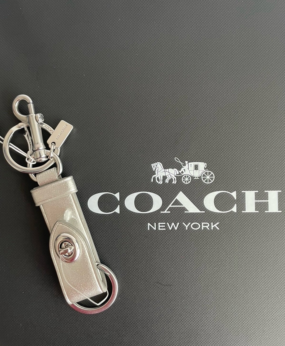 Coach trigger snap bag charm