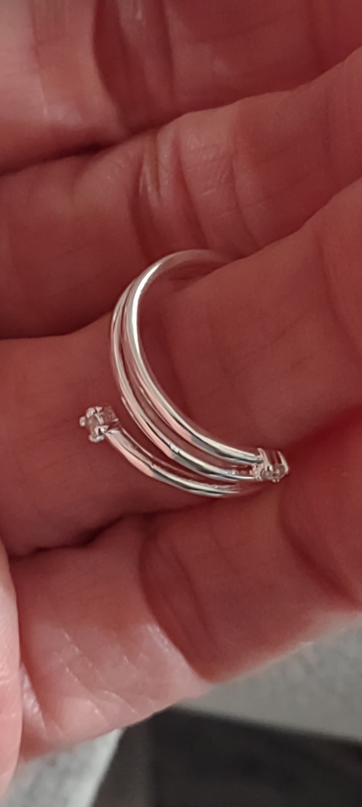 Size 7 wrap around the ring 925 Sterling and labcultured diamonds.