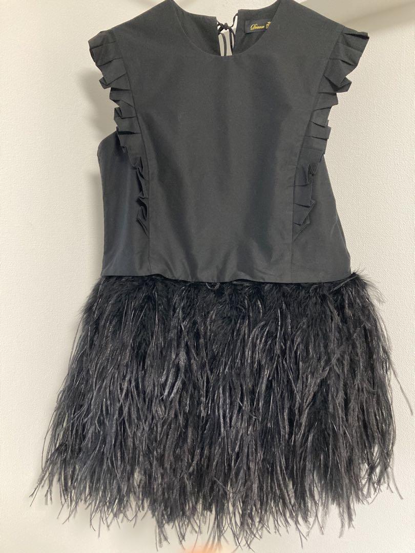 Black sleeveless top with frills