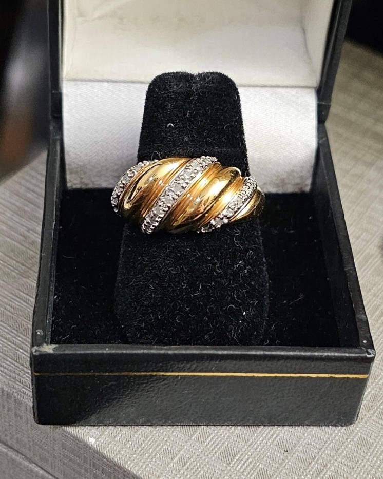 Diamond ring size 9. Sterling silver with a gold wash. Display box not included.