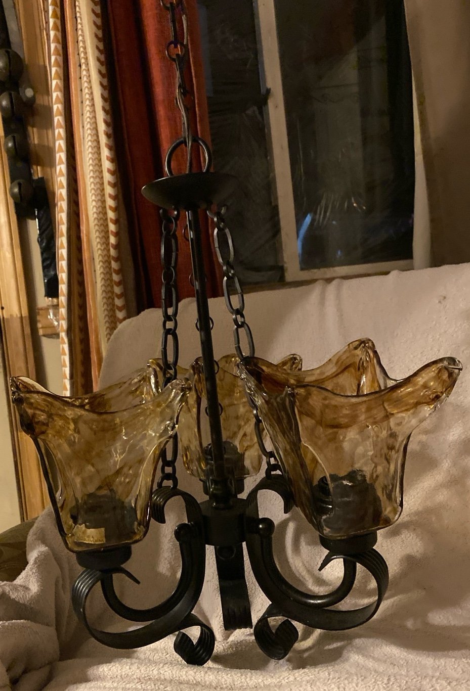 Contemporary Wrought
Iron-Style Chandelier
Hand-Blown Amber glass