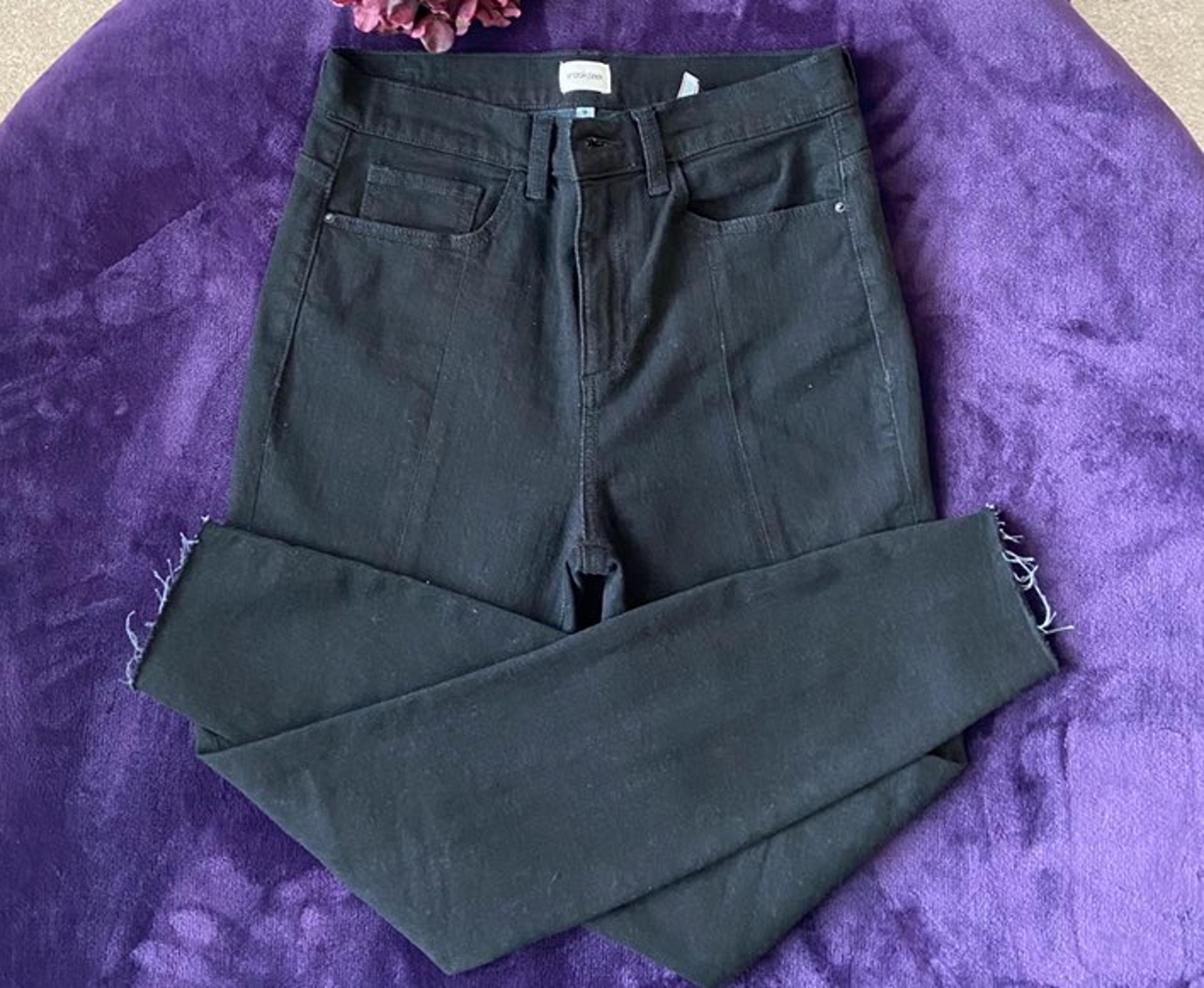 Sneak peek black skinny jeans.