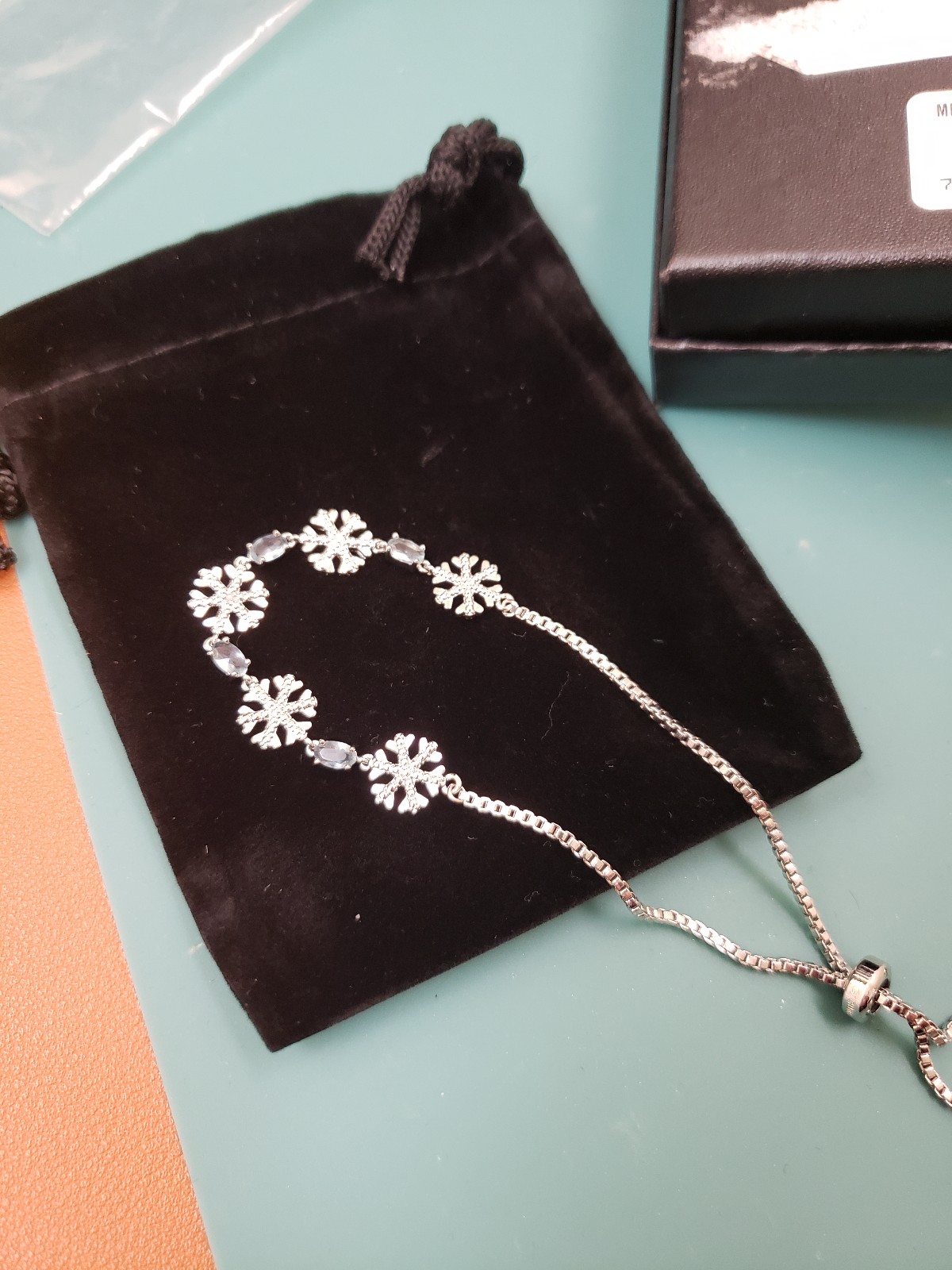 Macy's Fine Jewelry, NWT, Silver snowflakes aquamarine gemstone adj bracelet
