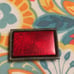 Ruby Red 1960 belt buckle