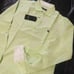 Brand new unused item with tag attached. Burberry Black Label long-sleeve shirt in green tones.