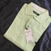 Brand new unused item with tag attached. Burberry Black Label long-sleeve shirt in green tones.