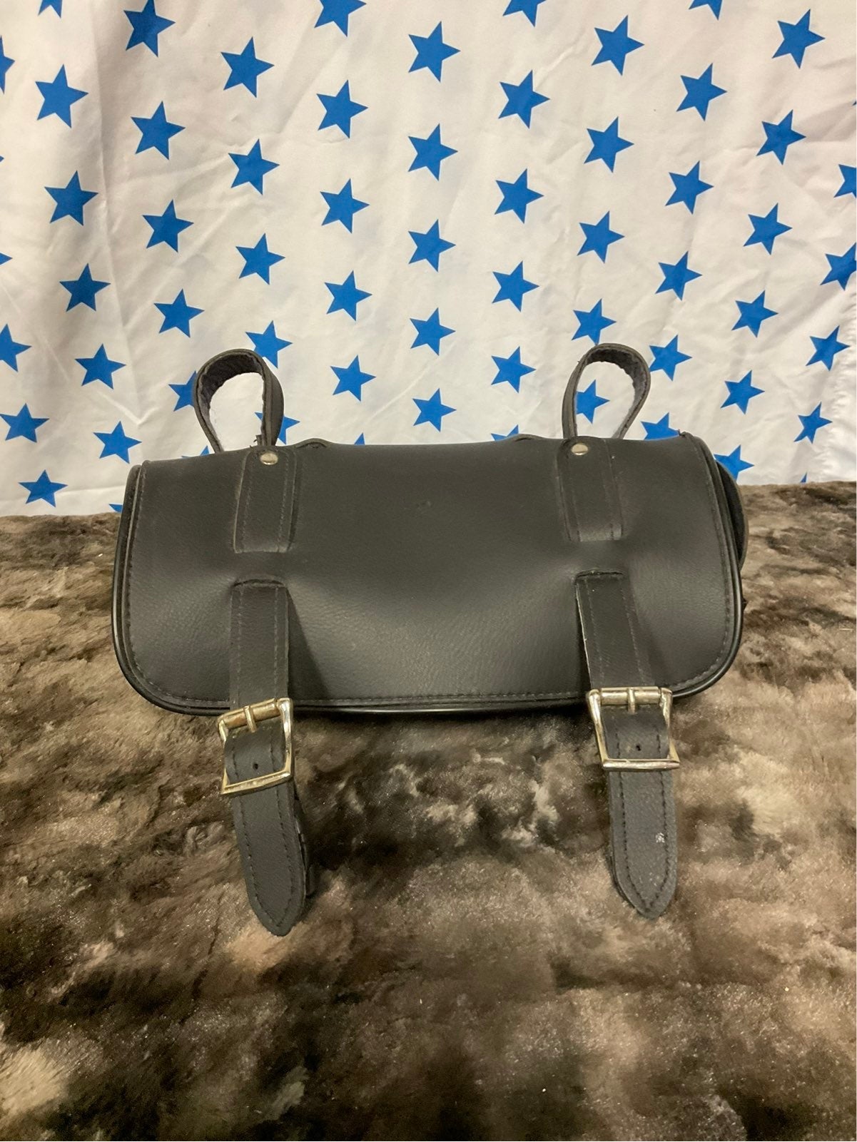 Circular black leather bicycle bag