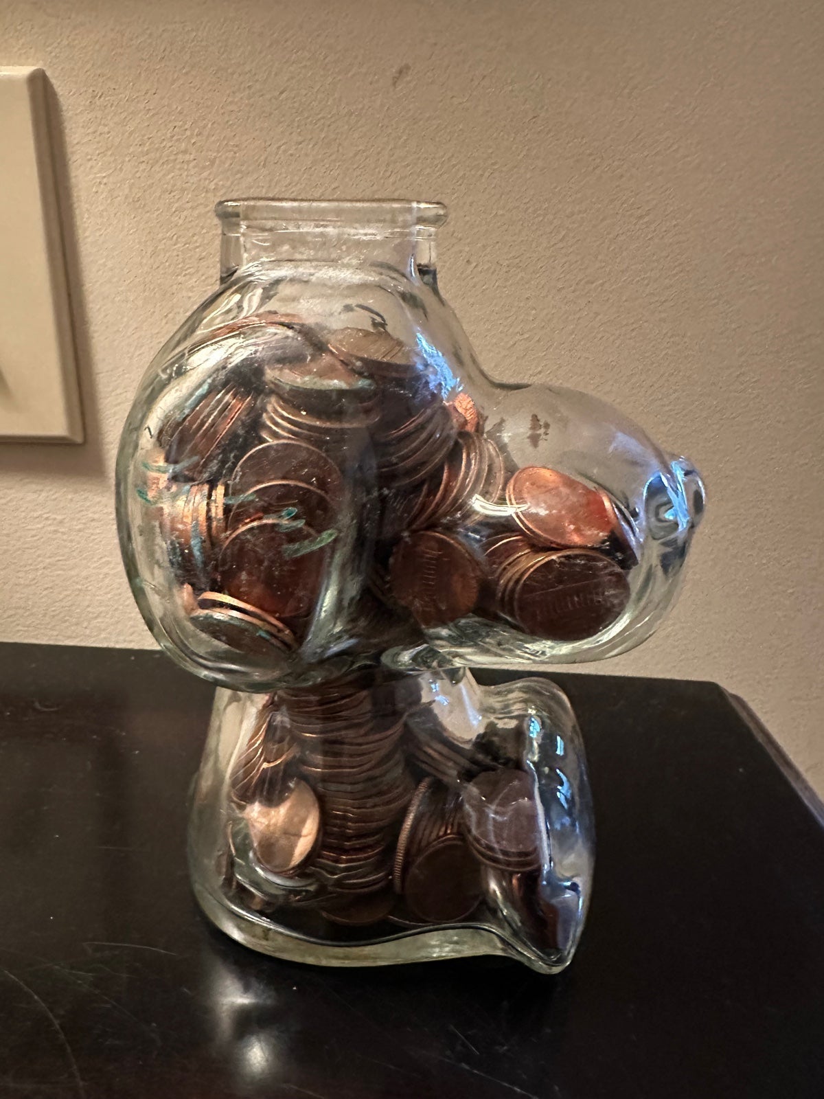 Vintage snoopy piggy bank with full off old pennies some quarters