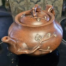 Chinese clay teapot with dogwood branching/3 in tell by 6 in wide