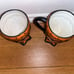 Rare Rae Dunn M Magenta set of 2 footed orange black polka dot mugs footed. Ve