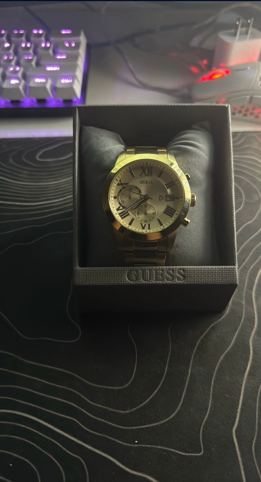 Gold men’s guess watch