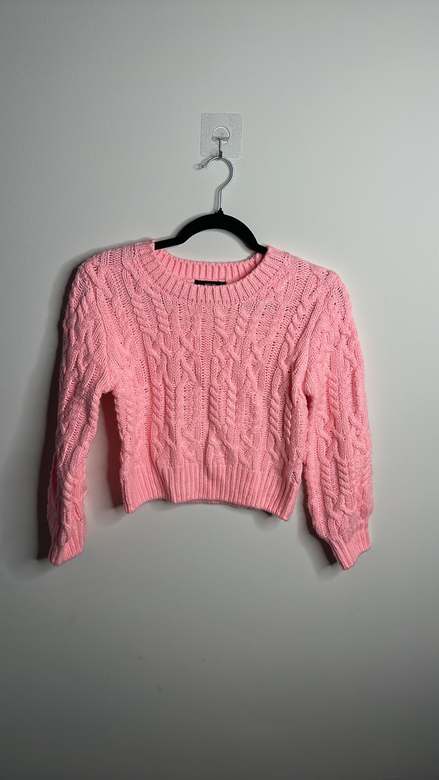 A girls’ sweater is a cozy and warm knit garment designed for cooler weather. M