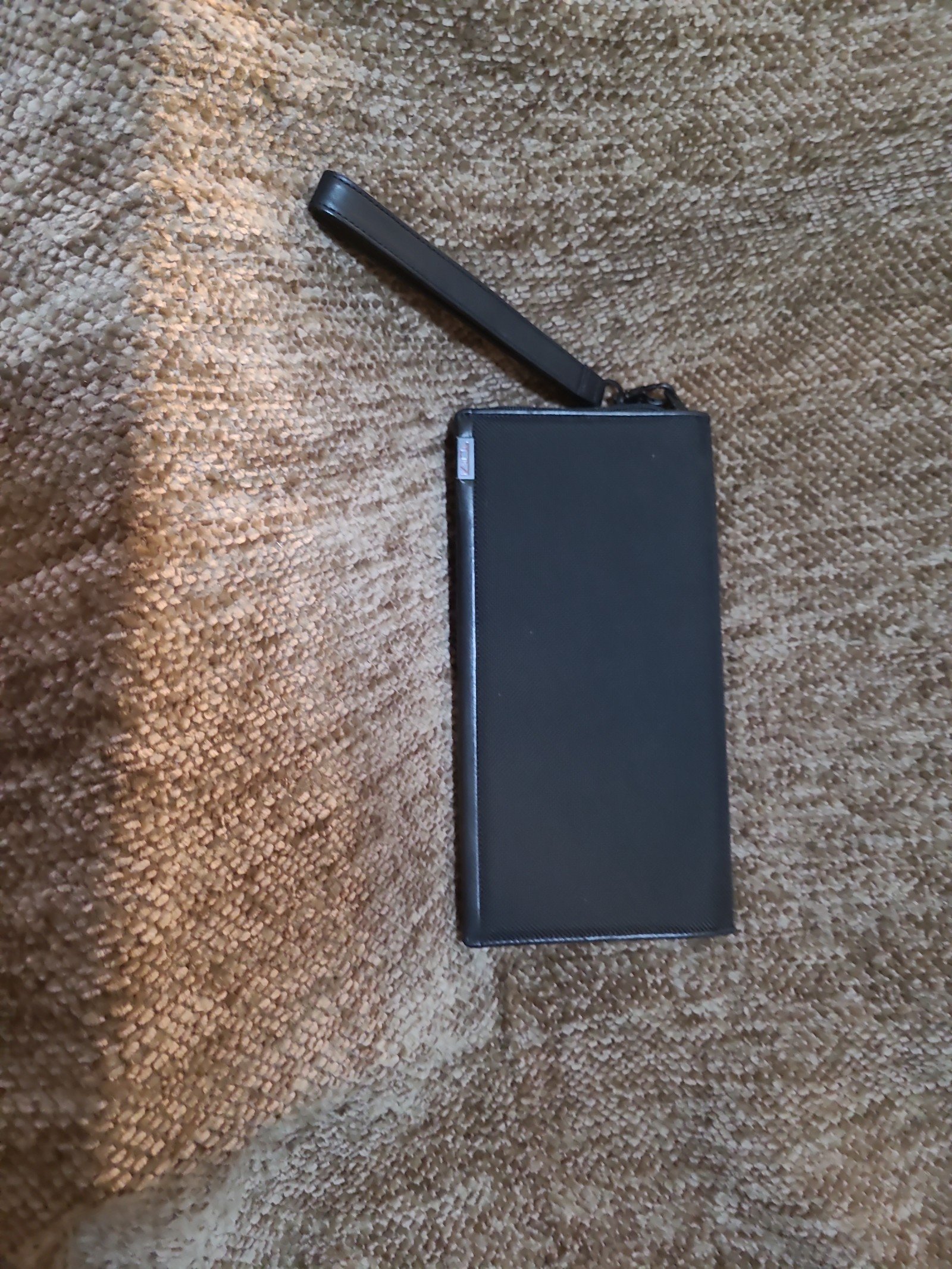 TUMi zippered enclosure. Travel wallet w. WRIST carry.