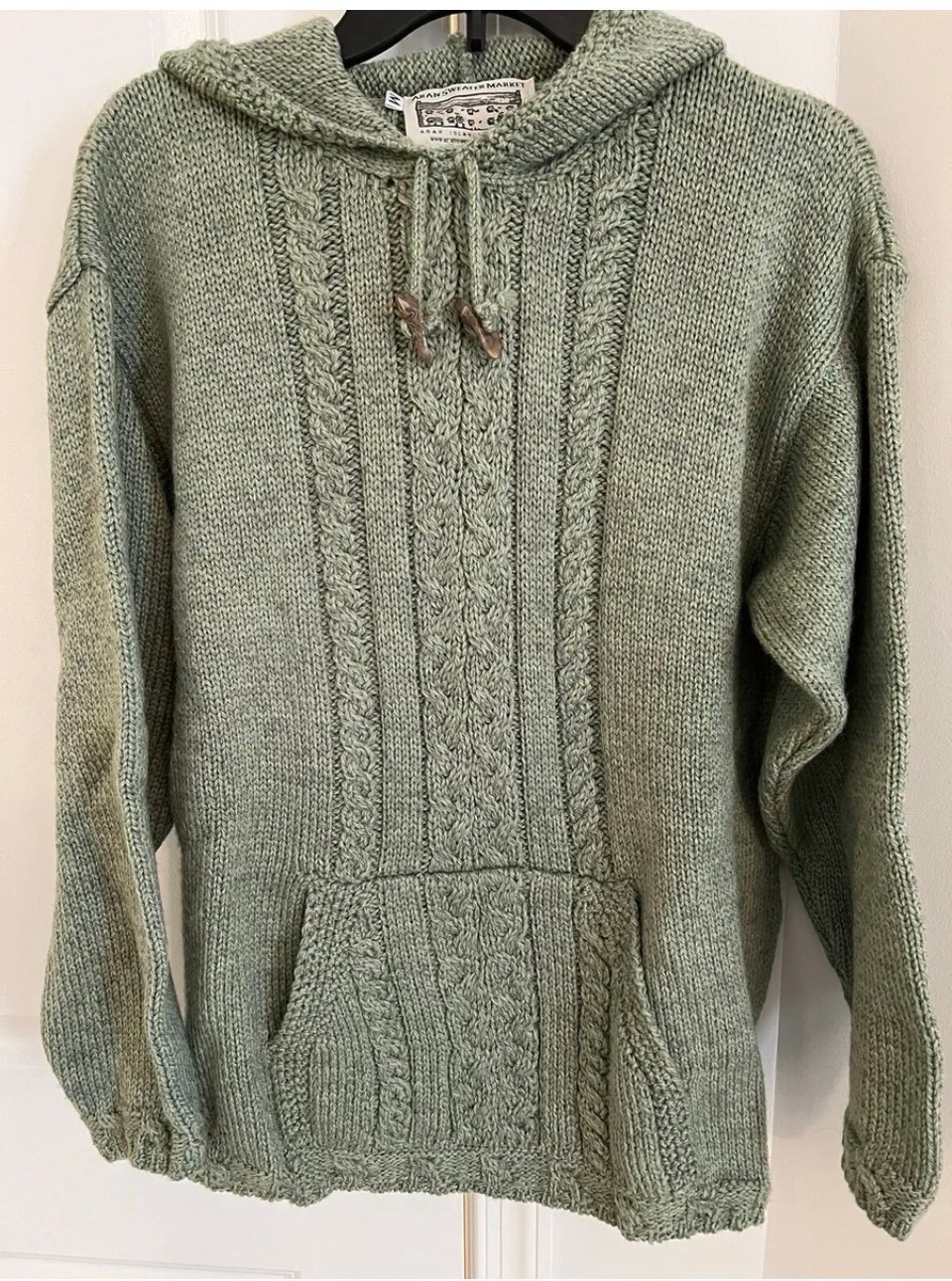Women’s l/s seafoam green merino wool sweater, size medium. Pouch pocket & hood.