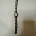 Gruen Swiss Women's watch. Small face with gold trim. GSL034, 269, 753