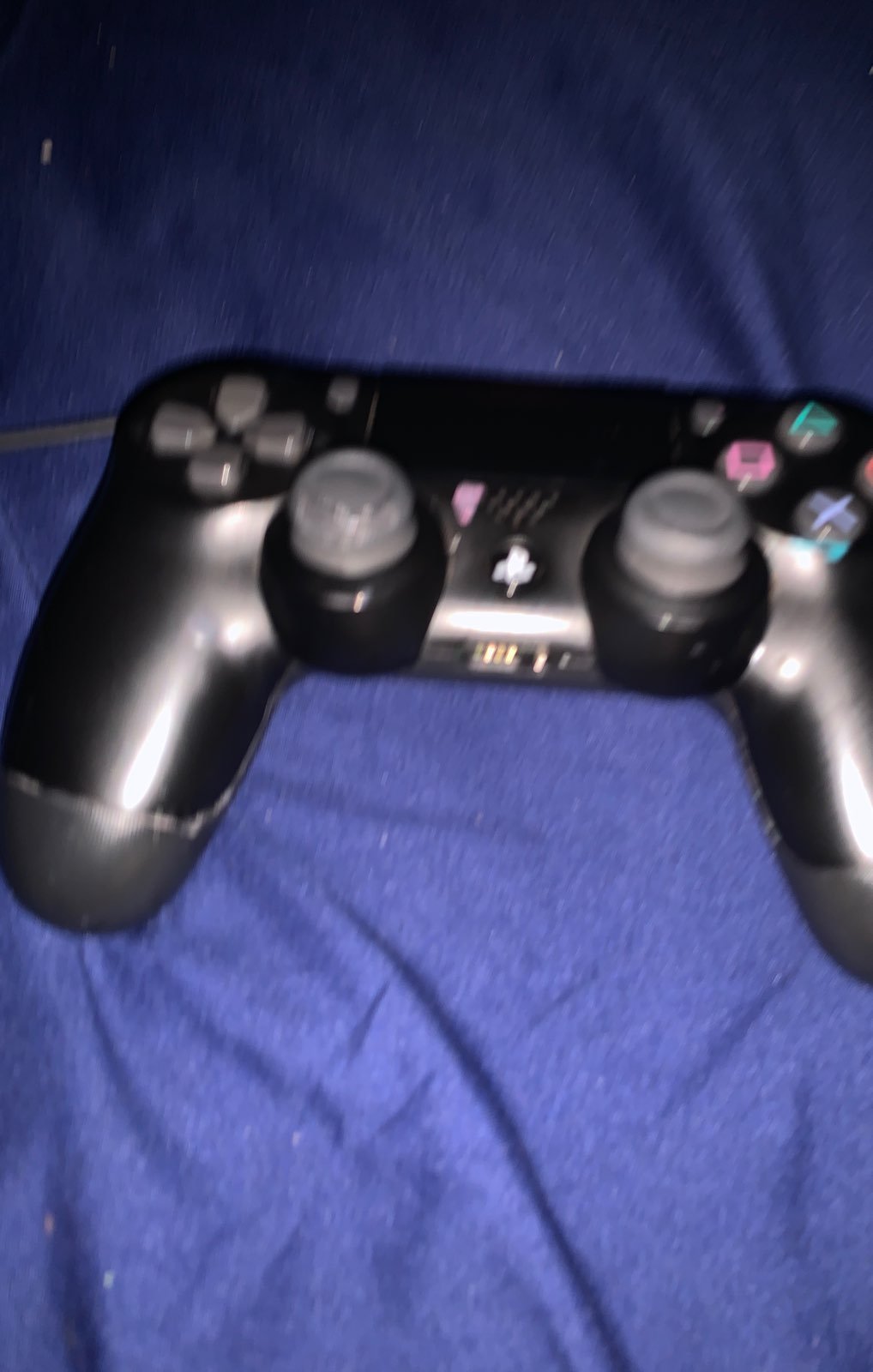 A black Playstation 4 controller