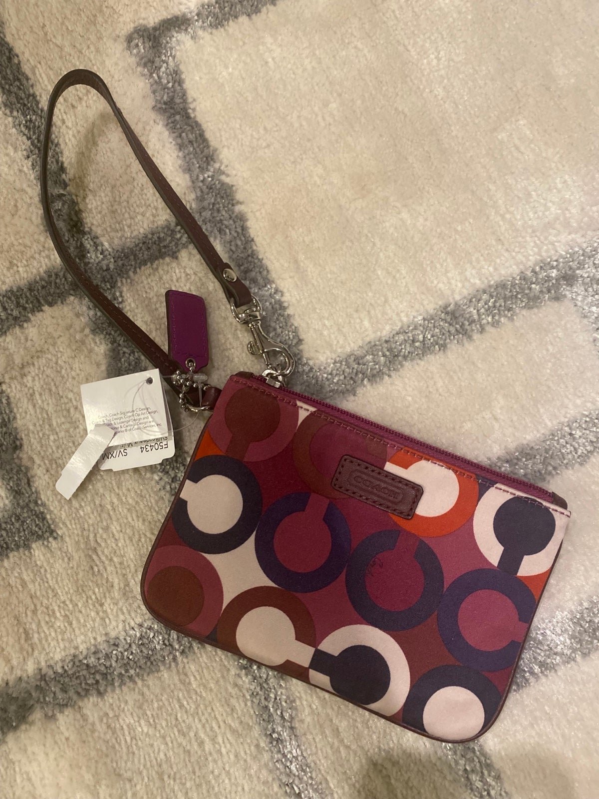 Coach F50434 Parker Bordeaux multi op art wristlet NWT