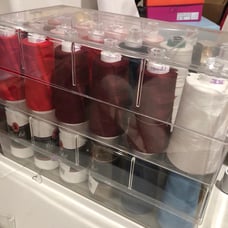 Storage spool box with 18 serger threads