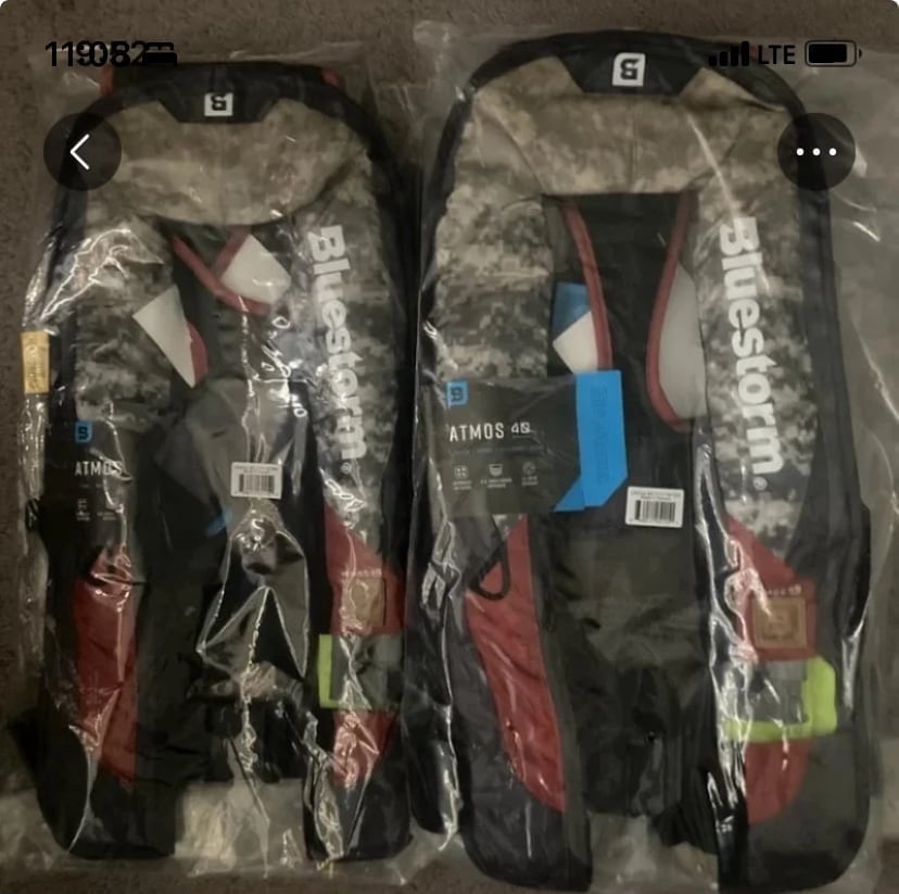 2 blue storm life jackets