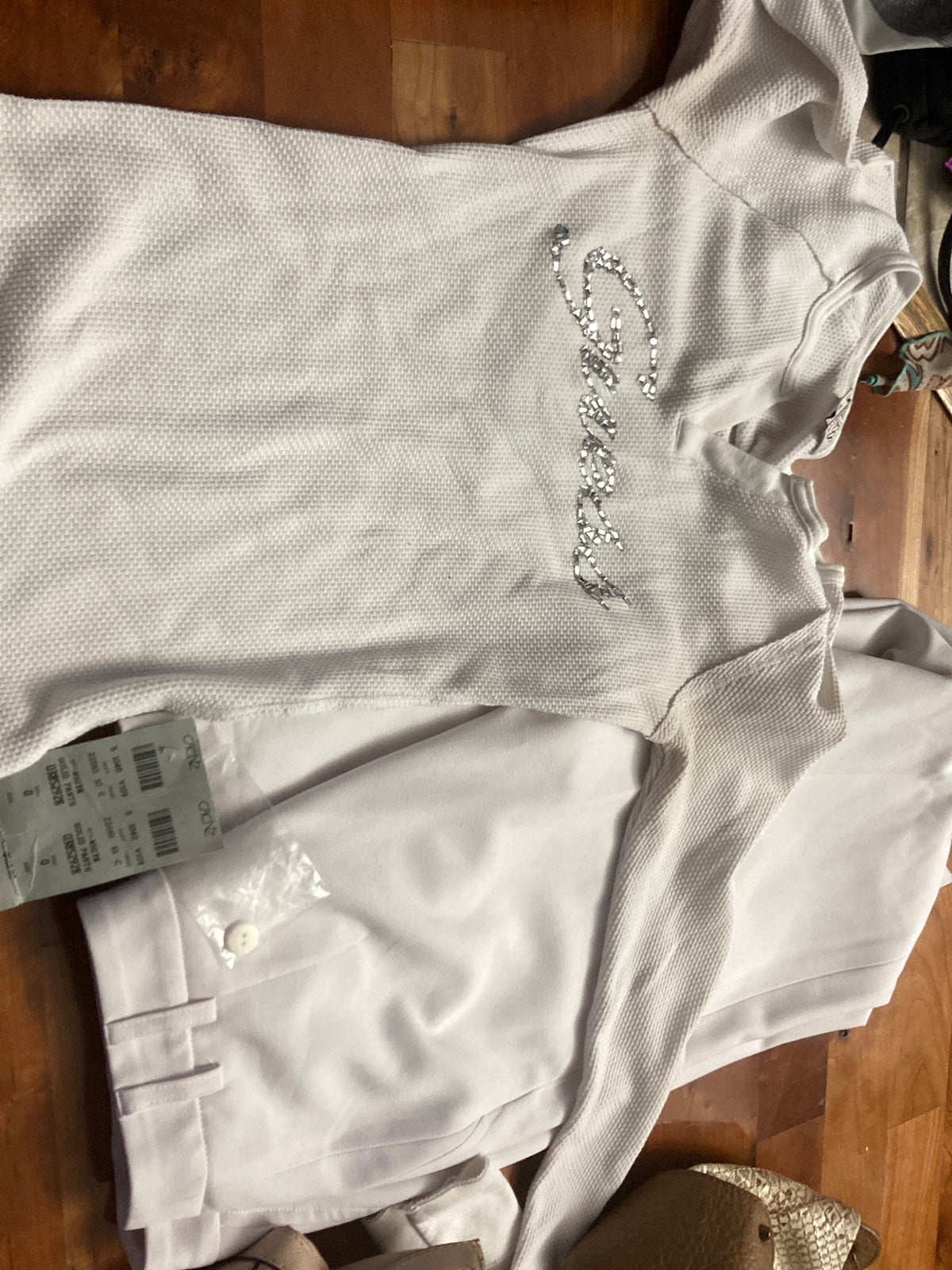 Cache pants with tags, Jessica Simpson purse, guess purse and guess shirt