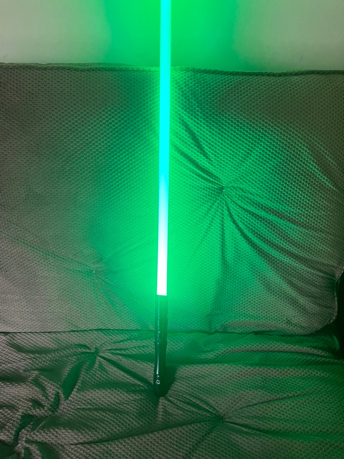 Black hilt green lightsaber