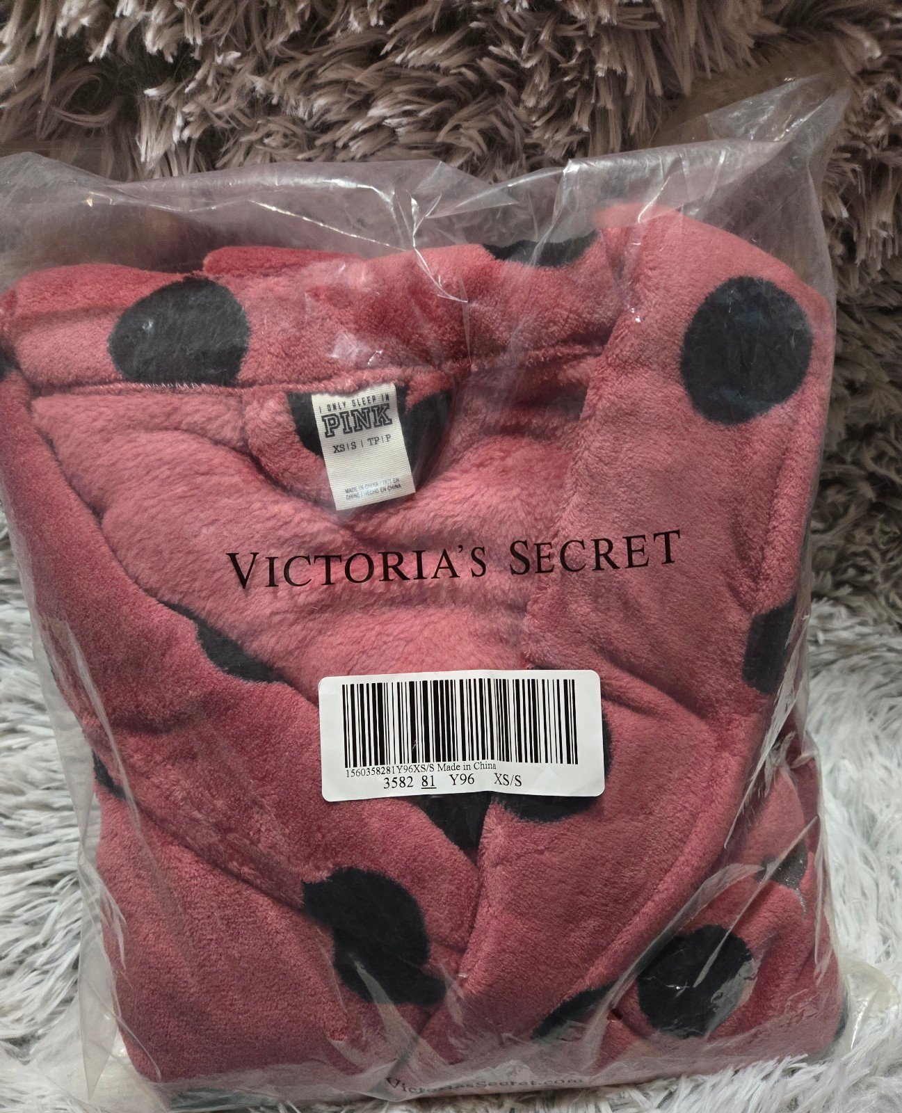 Pink Victoria's Secret robe.