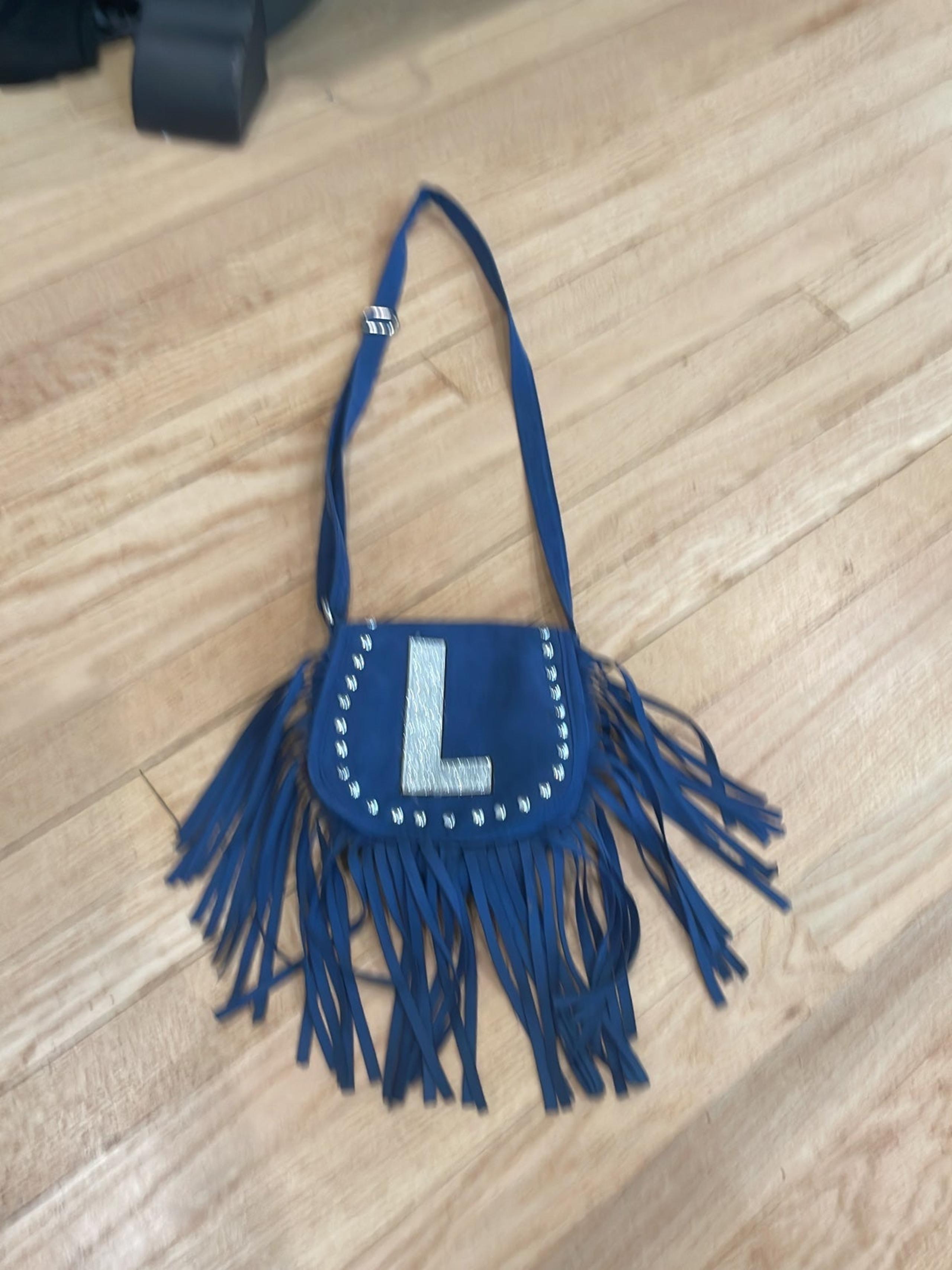 Justice blue “L” crossbody bag