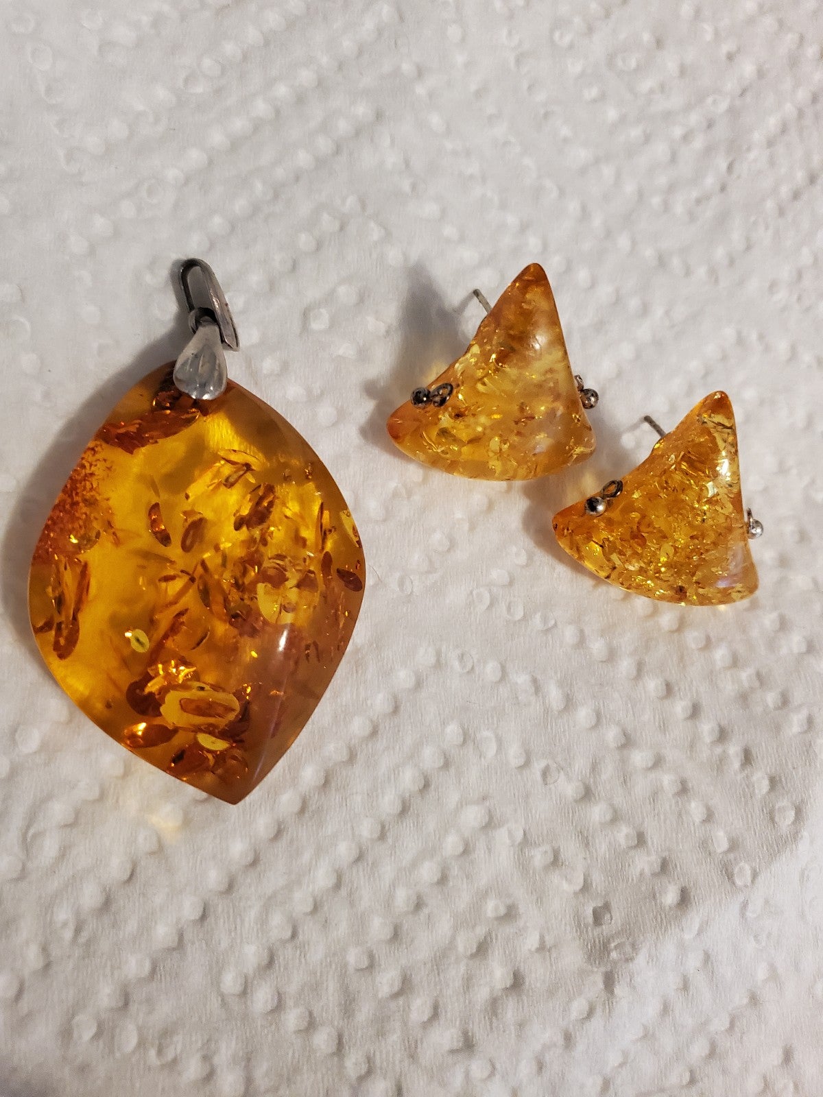 Sterling silver and amber pendant and earring set.
