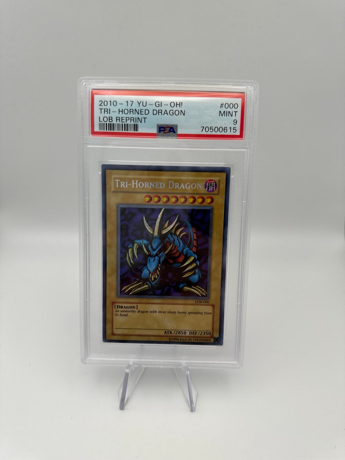 PSA 9 Tri-Horned Dragon LOB Reprint (Unlimited)