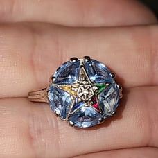 10k white gold ring with blue topaz and multi gems.