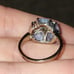 10k white gold ring with blue topaz and multi gems.