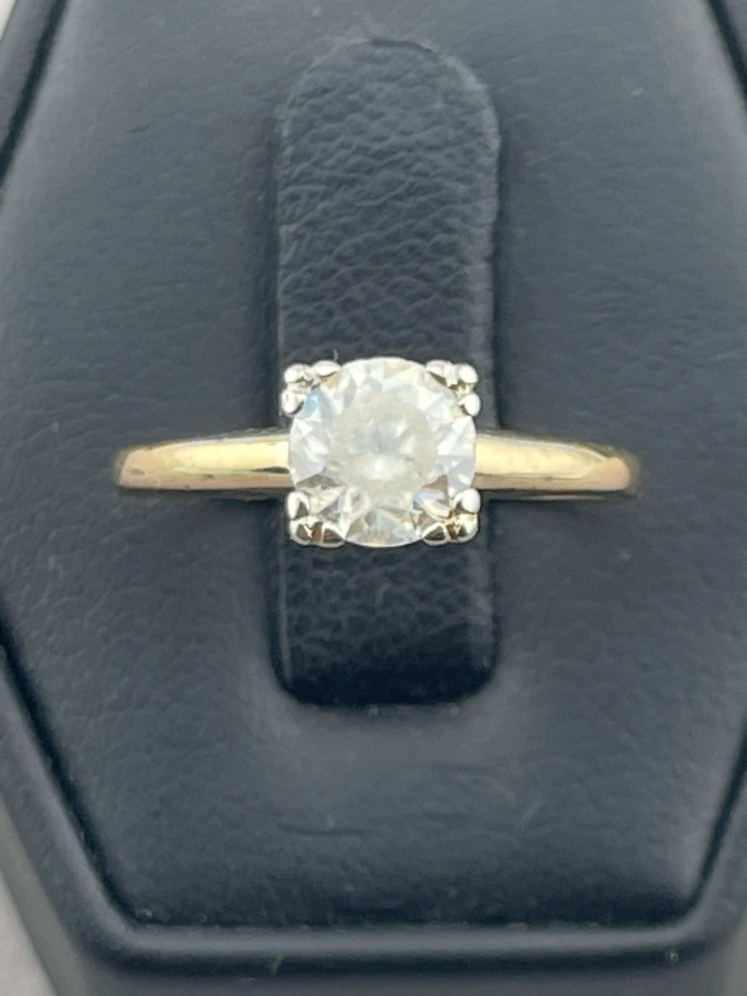 Antique yellowish tinge stone engagement ring 14 karat yellow gold