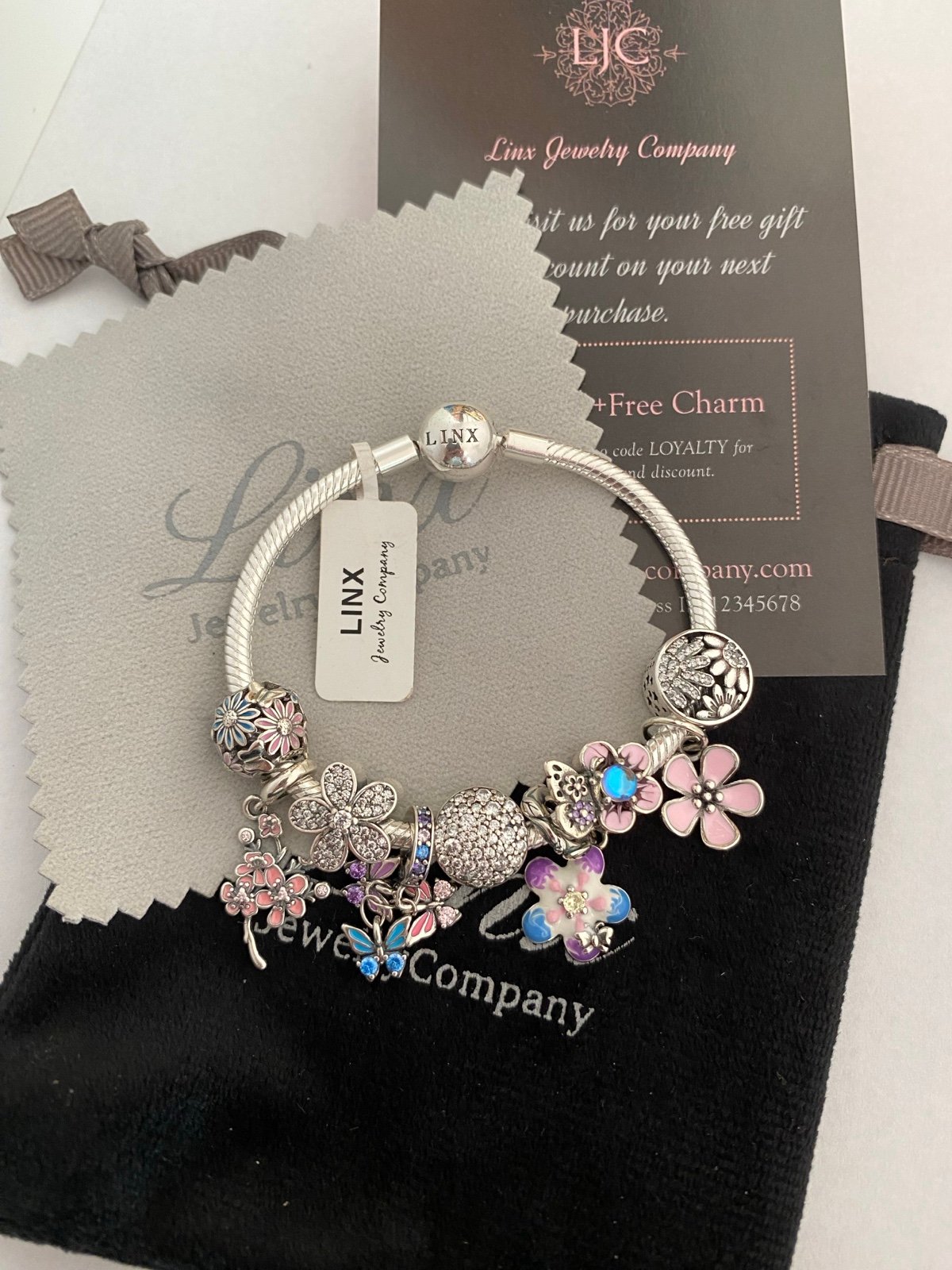 Linx Snake Chain Bracelet with Pale Pink Baby Blue and Purple Themed Charms