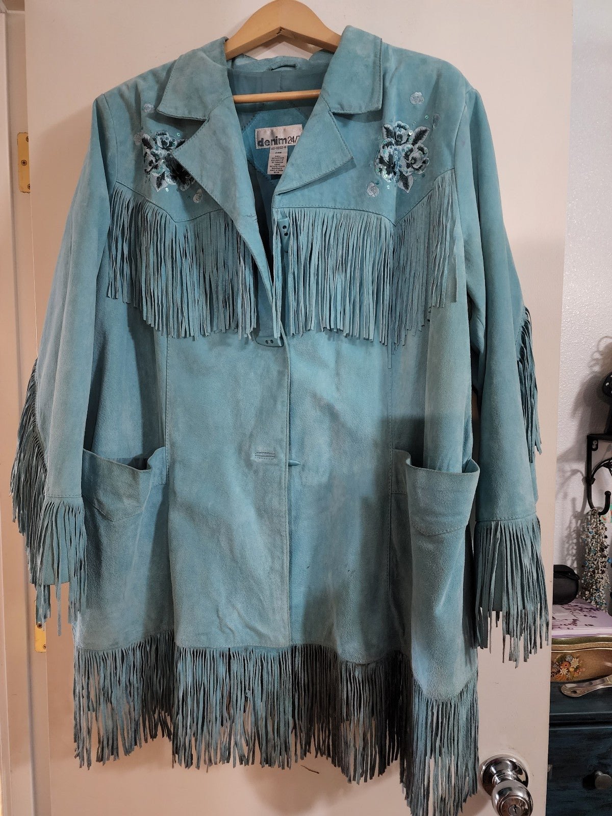 Leather Fringe jacket with embroidery on front and back. Fully lined.