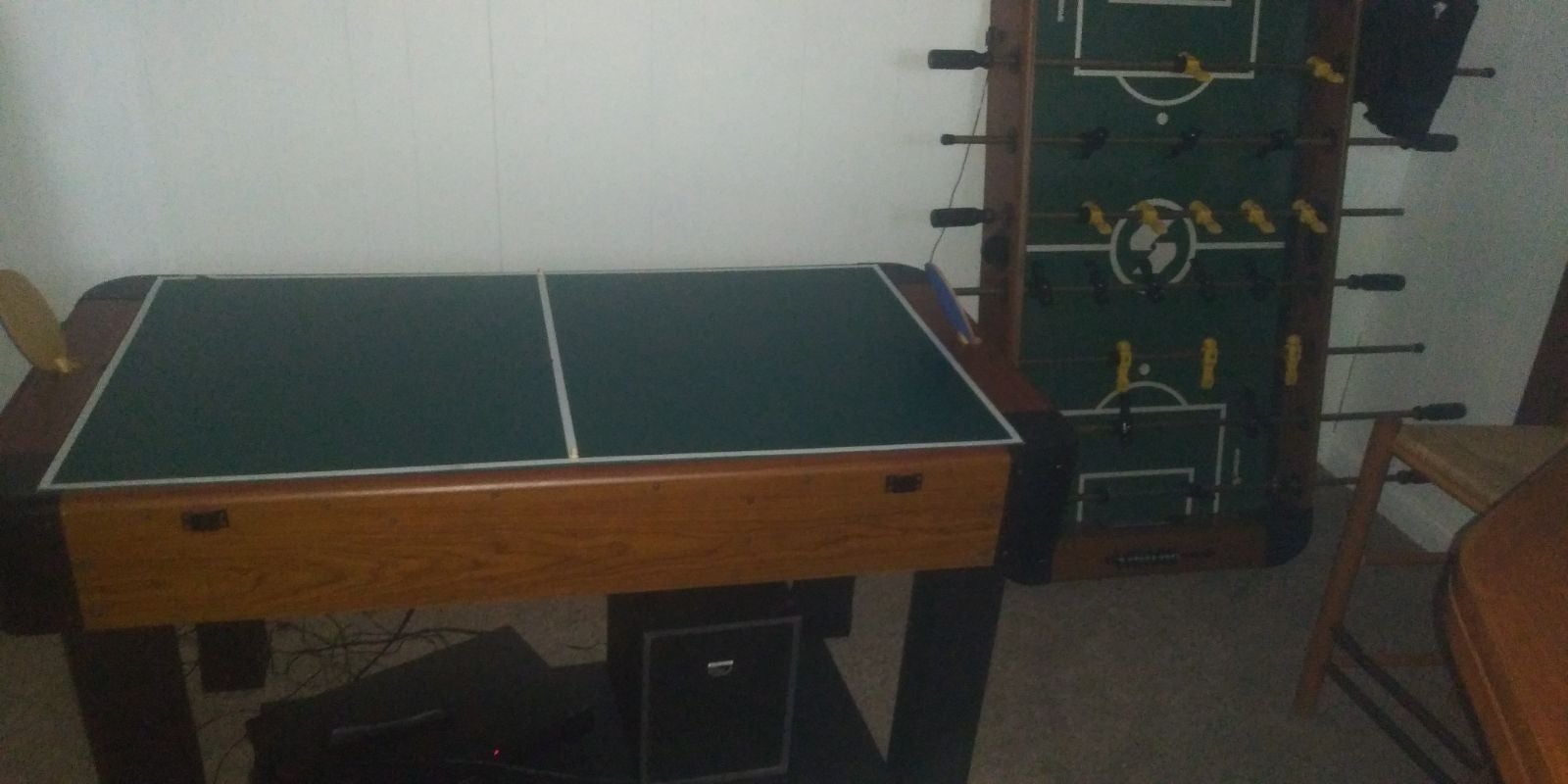 Foosball table ping pong table air hockey table has a chess board and I don't kn
