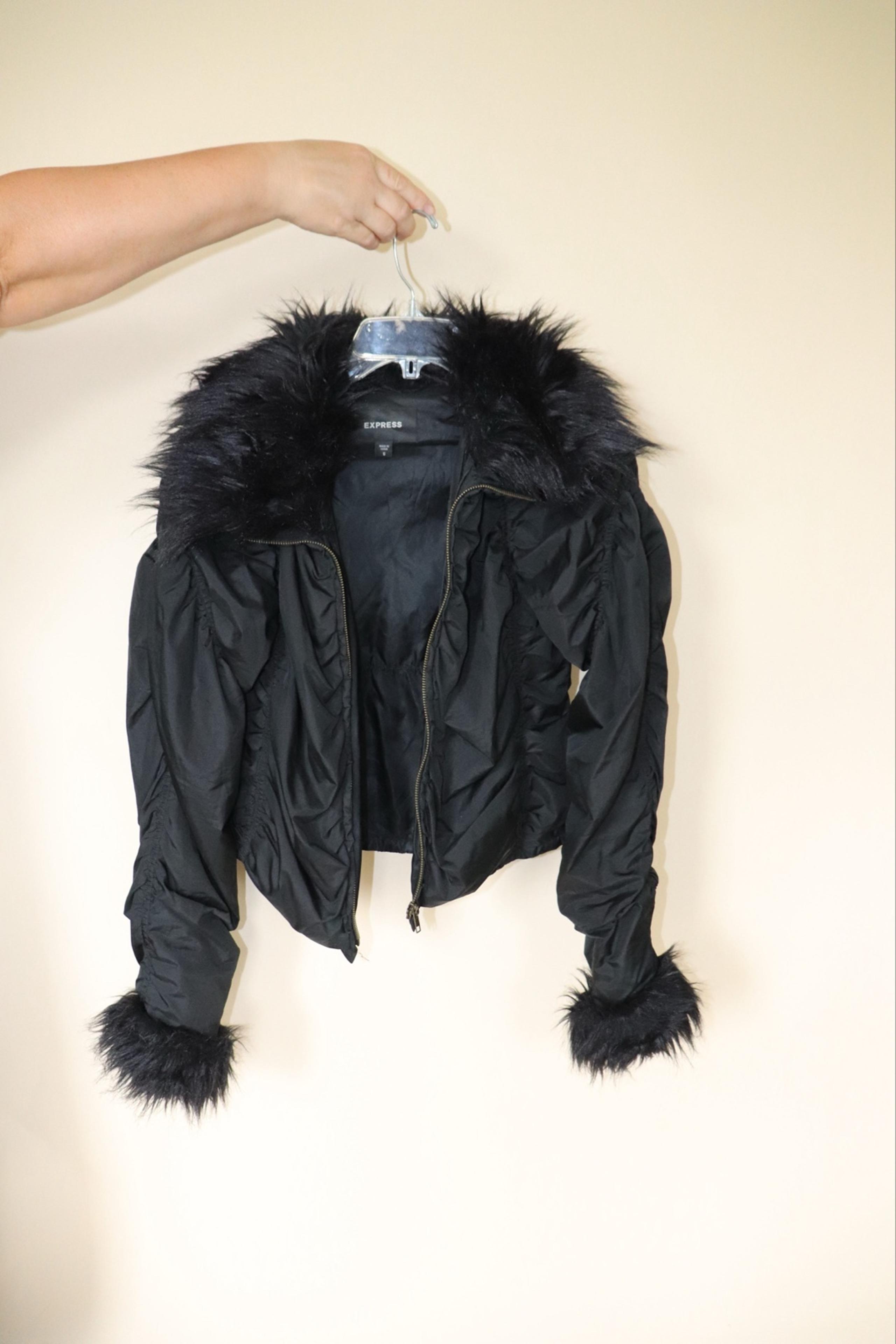 Women’s express coat with fur collar and fur sleeves.