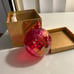 Glass luminescent red Christmas ball ornament by Glass Eye Studio in Candy Red