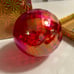 Glass luminescent red Christmas ball ornament by Glass Eye Studio in Candy Red