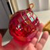 Glass luminescent red Christmas ball ornament by Glass Eye Studio in Candy Red