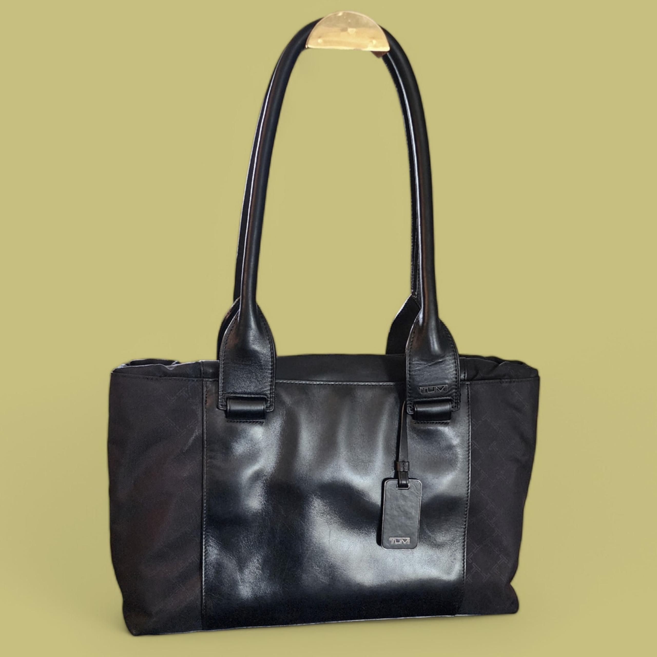 Tumi black leather Tinker lust shoulder carry-on bag