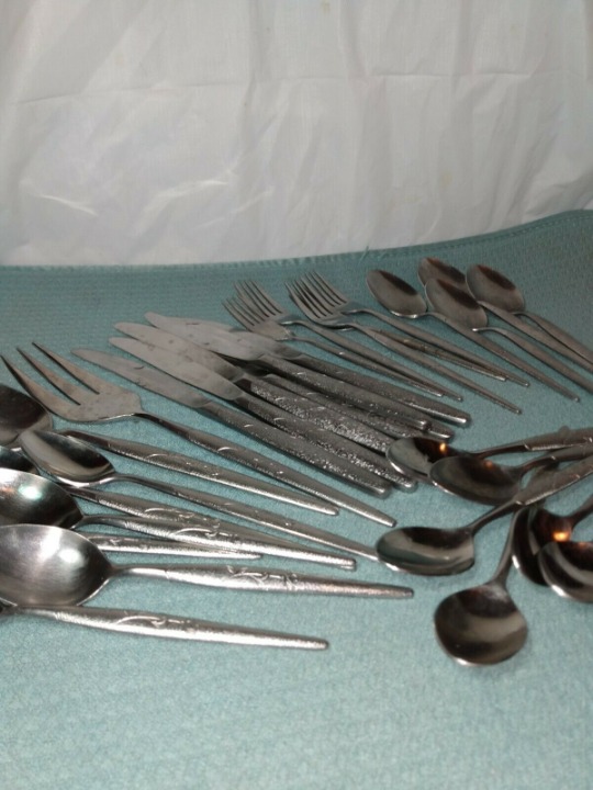n.s. co. stainless 30 peice Flatware w flowers some wear and scratches vintage