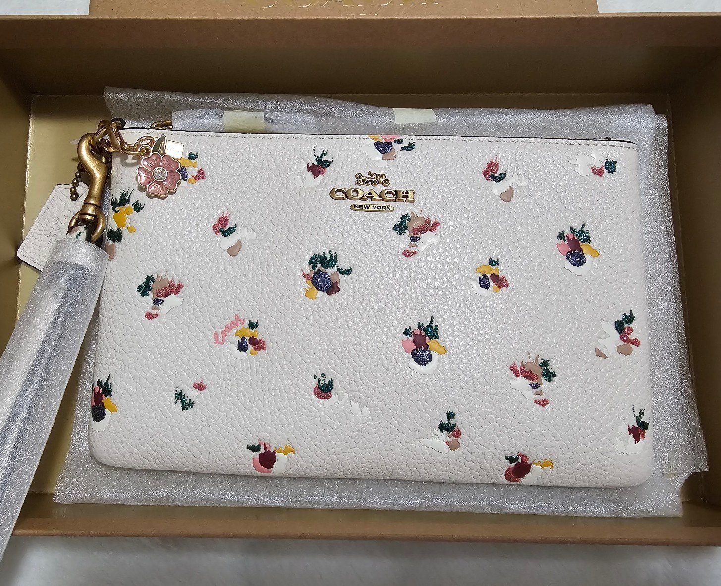 Coach small wristlet with pink floral bag charm