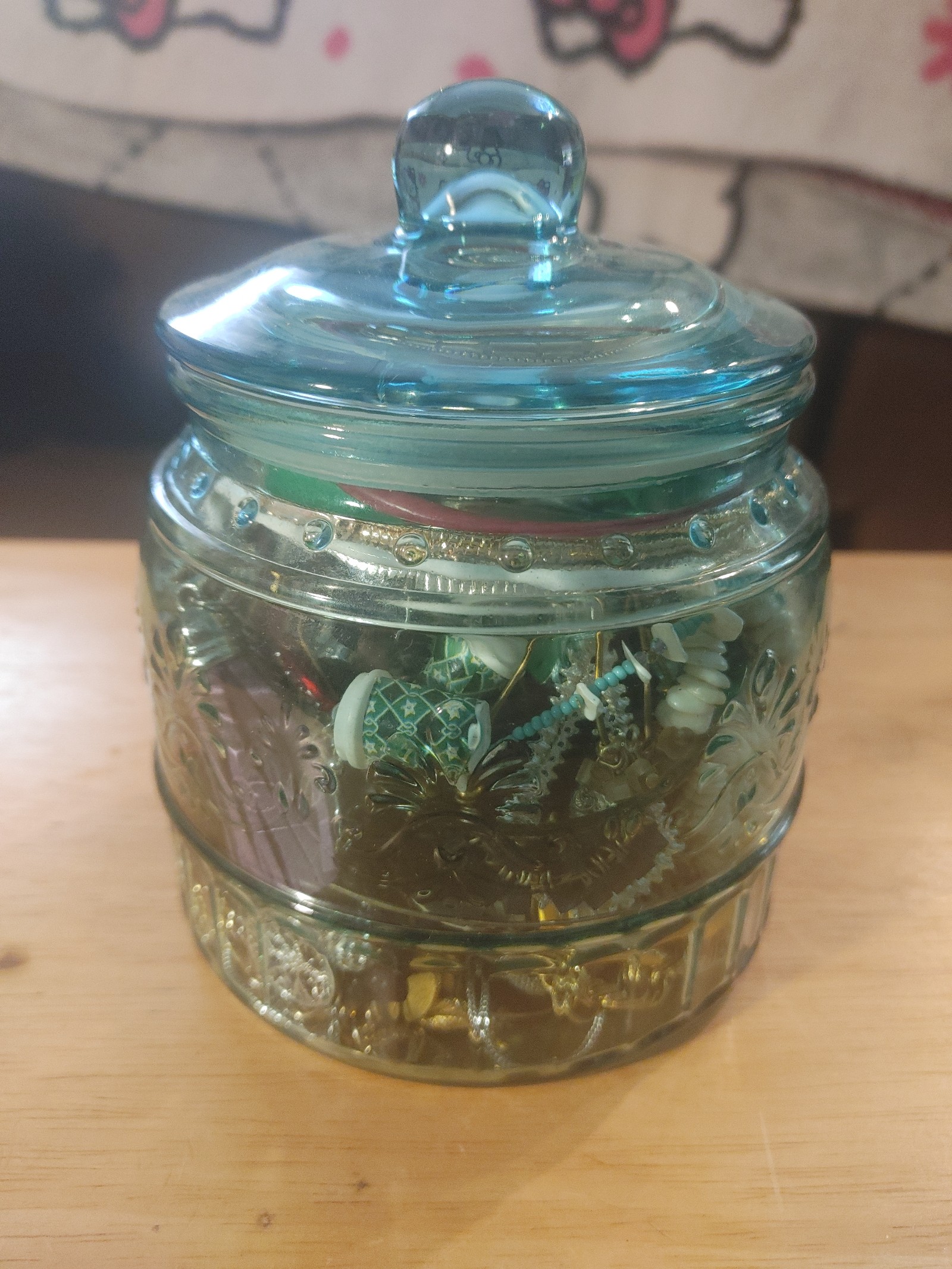 Glass jar of mystery jewely