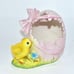VINTAGE NORCREST PINK HATCHED EGG W/ A BOW, REVEALING A YELLOW CHICKADEE