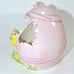 VINTAGE NORCREST PINK HATCHED EGG W/ A BOW, REVEALING A YELLOW CHICKADEE