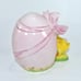 VINTAGE NORCREST PINK HATCHED EGG W/ A BOW, REVEALING A YELLOW CHICKADEE