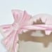 VINTAGE NORCREST PINK HATCHED EGG W/ A BOW, REVEALING A YELLOW CHICKADEE