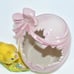 VINTAGE NORCREST PINK HATCHED EGG W/ A BOW, REVEALING A YELLOW CHICKADEE